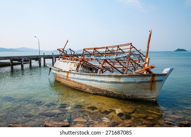abandoned fishing boat on coast