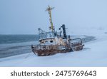 Abandoned fishing boat washed ashore during a heavy storm, Teriberka, Murmansk region, Barents Sea, Far North, Arctic Ocean, Russia