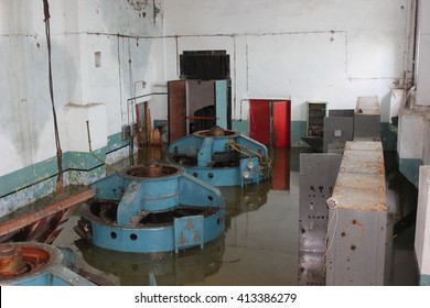 Abandoned flooded factory. Flood. Flooded mechanisms. 
flooded room