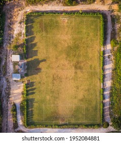 Abandoned Football Field From Above At Sunrise With Warm Light