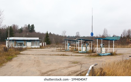 abandoned gas station and rusty pump at autumn day in Russia