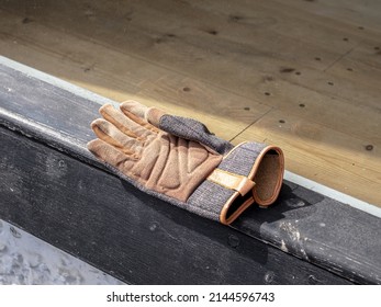 An Abandoned Glove On Window Sill Of Vacant Shop