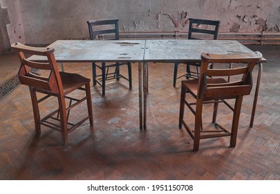 Abandoned grade 2 listed church and the echoing reminiscence of so many meetings and lost conversations that were held over these table and chairs                    - Shutterstock ID 1951150708