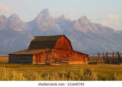 Abandoned homesteader's barn on "Mormon Row", with Teton Range in background, sunrise, Grand Teton National Park, Jackson Hole, Wyoming.