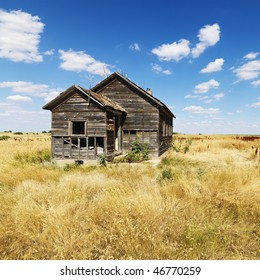 Abandoned House In State Of Disrepair In Field In Rural North Dakota. Square Format.