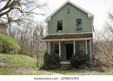 An abandoned house that resides in an abandoned village from an old miners town.