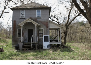 An abandoned house that resides in an abandoned village from an old miners town.