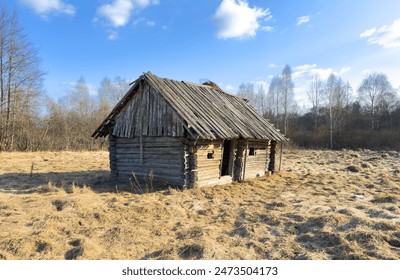 Abandoned house in village. Old wooden house in countryside in spring. No people in village. Old House in rural. Abandoned village with destroyed houses. Wooden Home ruin in countryside - Powered by Shutterstock