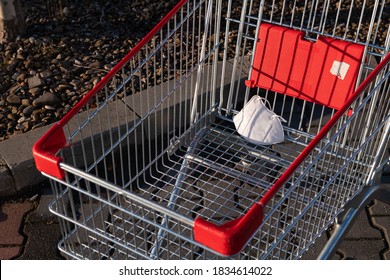 Abandoned KN95 Medical Protection Mask On A Shopping Cart In The Park Yard