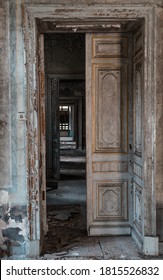 Abandoned Mansion Interior. View Through Open Grunge Doors Enfilade. Spooky House Concept.