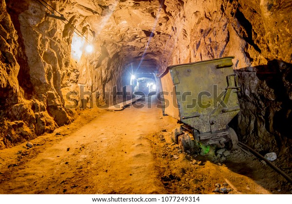 Abandoned mine with rails for\
cars