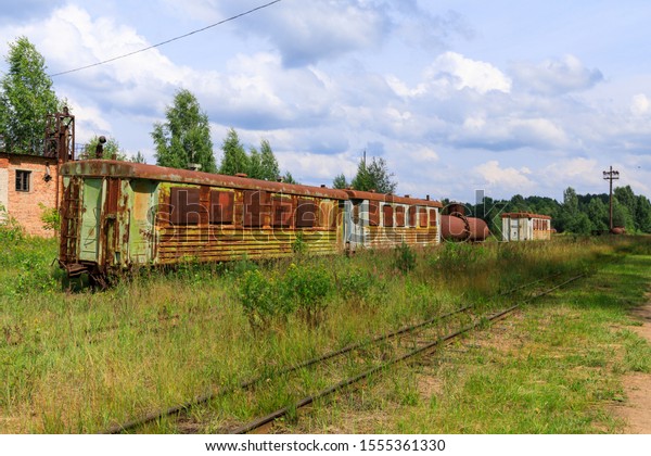 abandoned narrow gauge railway, Branches of the\
railway at the marshalling yard, forest and lonely road in the\
middle Russia.