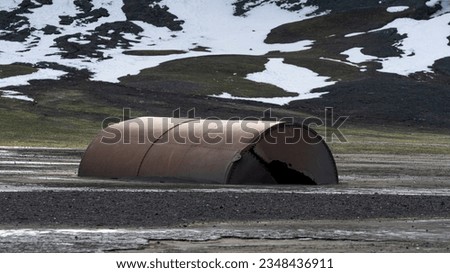 Abandoned norwegian whale hunter station rusty blubber tanks. High quality photo