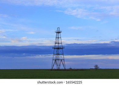 Abandoned Oil And Gas Rig Profiled On Sky