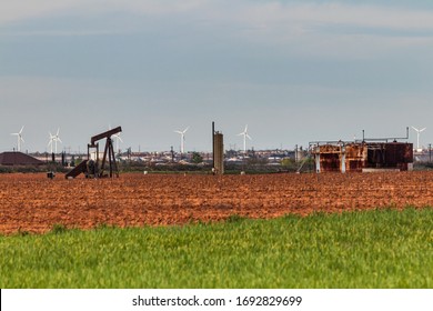 Abandoned Oil Well And Wind Turbines