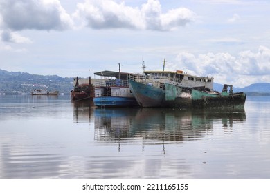 Abandoned Old Boats Anchored Side By Side In The Coastal Area With Calm Sea Conditions In The Morning