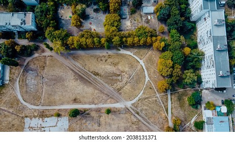 Abandoned Old Football Stadium. Soccer At Dirty Field. Areal View.