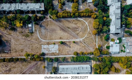 Abandoned Old Football Stadium. Soccer At Dirty Field. Areal View.