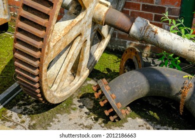 Abandoned Old Industrial Machinery With Rusting Orange Metalwork.