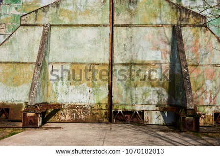 Abandoned old military hangar for storage and maintenance of fighter jets and other military aircraft