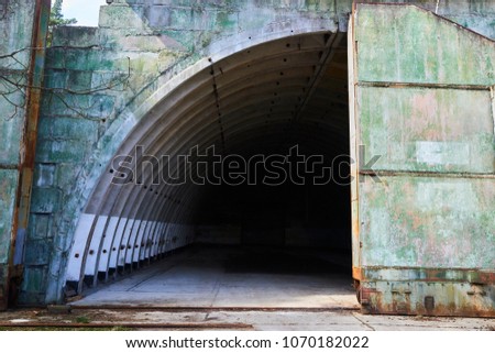 Abandoned old military hangar for storage and maintenance of fighter jets and other military aircraft