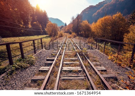 Abandoned old railway in mountains in autumn. 