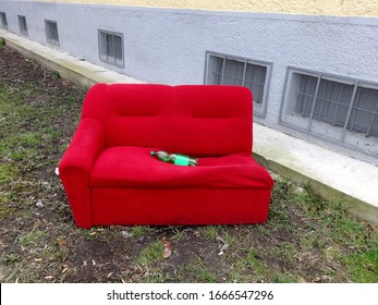 Abandoned Old And Red Couch