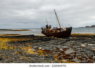 Abandoned Old Ship On The Coast Of The Arctic Ocean. Cape Nemetskiy (Rybachiy Peninsula), Russia.
