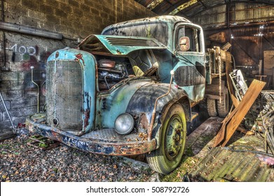 Abandoned old truck in a garage - Powered by Shutterstock