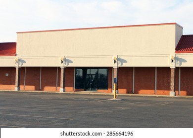Abandoned or out-of-business big box store in a strip mall.