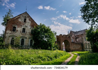 Abandoned and overgrown red brick gates and mansion of former Kikin Ermolov's manor, Ryazan region, Russia - Powered by Shutterstock