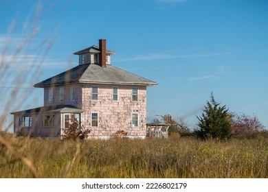 Abandoned Pink House near Plum Island and Newburyport Massachusetts is a beloved local landmark
 - Shutterstock ID 2226802179