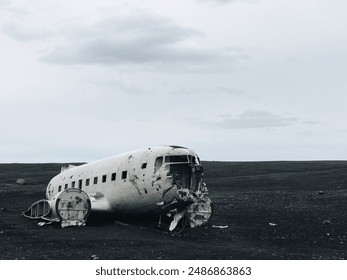 Abandoned plane wreck on black sand beach in iceland  - Powered by Shutterstock