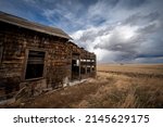 Abandoned post office building near Mossleigh Aberta in early sping.