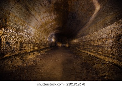 Abandoned prospecting adit. Tunnel at limestone at abandoned mine