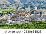 Abandoned quarry in Almenara, Valencia, Spain. Depleted gravel open-pit operated. Lime mortar, Cement production. Сrushing Plant, Belt conveyor in mining quarry. Stone crushing.