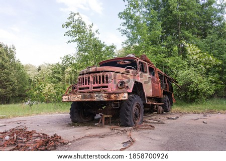 Abandoned radioactive vehicle, fire truck near Circle radar complex at Duga antenna, summer season in Chernobyl exclusion zone, Ukraine