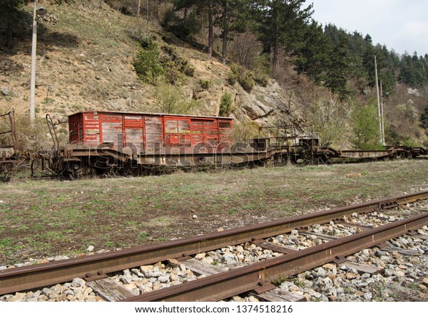 Abandoned rail cars on\
siding in Bulgaria