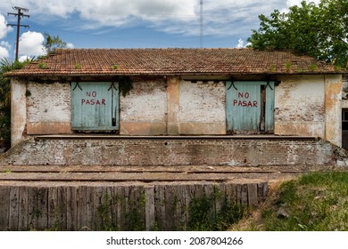 Abandoned Rail Depot With Do Not Pass Signs On Its Doors