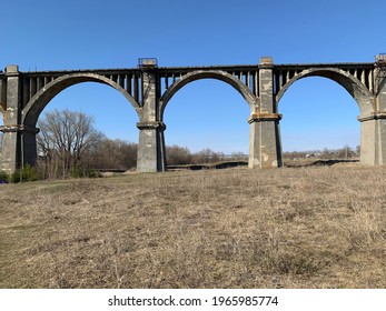 an abandoned railway bridge (viaduct) near the village of Mokry (Chuvashia, Russia) in the spring; field and sky 

 - Shutterstock ID 1965985774