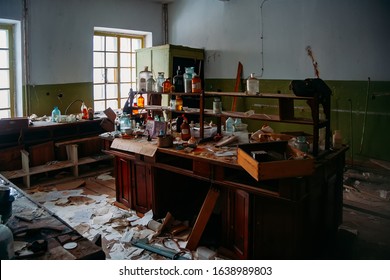 Abandoned ruined chemical laboratory. Old broken glassware