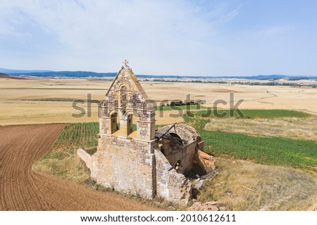 abandoned ruined church in the middle of the countryside in Spain. Depopulation in rural areas and loss of artistic heritage