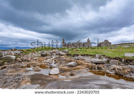 Abandoned ruins of an old Irish cottage by the shore
