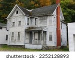 An abandoned and rundown white house near Watkin Glens, Upstate New York