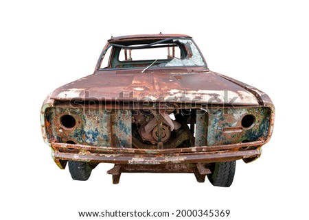 An abandoned rusted car isolated on white background with clipping path.