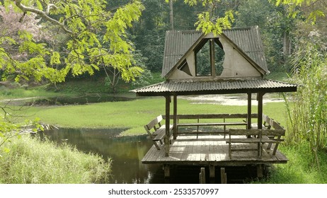 Abandoned rustic wooden hut by serene lakeside, lush greenery and vibrant trees of tranquil forest, Outdoor Relaxation and Nature. - Powered by Shutterstock