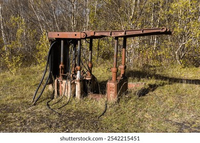 Abandoned rusty 1970s coal mine machinery: coalface roof supports called chocks with hydraulic rams and pipes - Powered by Shutterstock