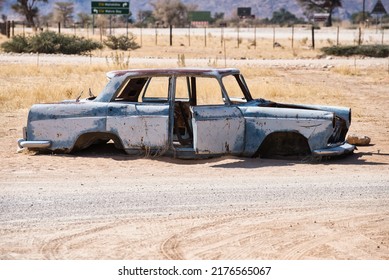 Abandoned Rusty Car Wreck In The Small Village Solitaire In Namibia. Lonely, Deserted, Vintage Scene. 