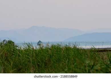 Abandoned Salt Evaporation Pond, Sea And Mountains