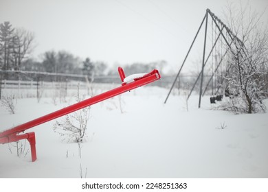 Abandoned Seesaw Playground in Snow, Wisconsin, United States - Powered by Shutterstock